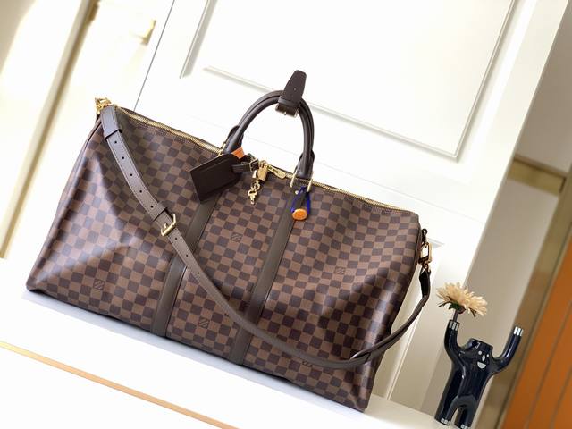 原单lv Keepall 55旅行袋 配肩带 型号：N41414 Keepall是lv旅行袋系列中的经典 中号keepall以monogram帆布为袋身，容量宽